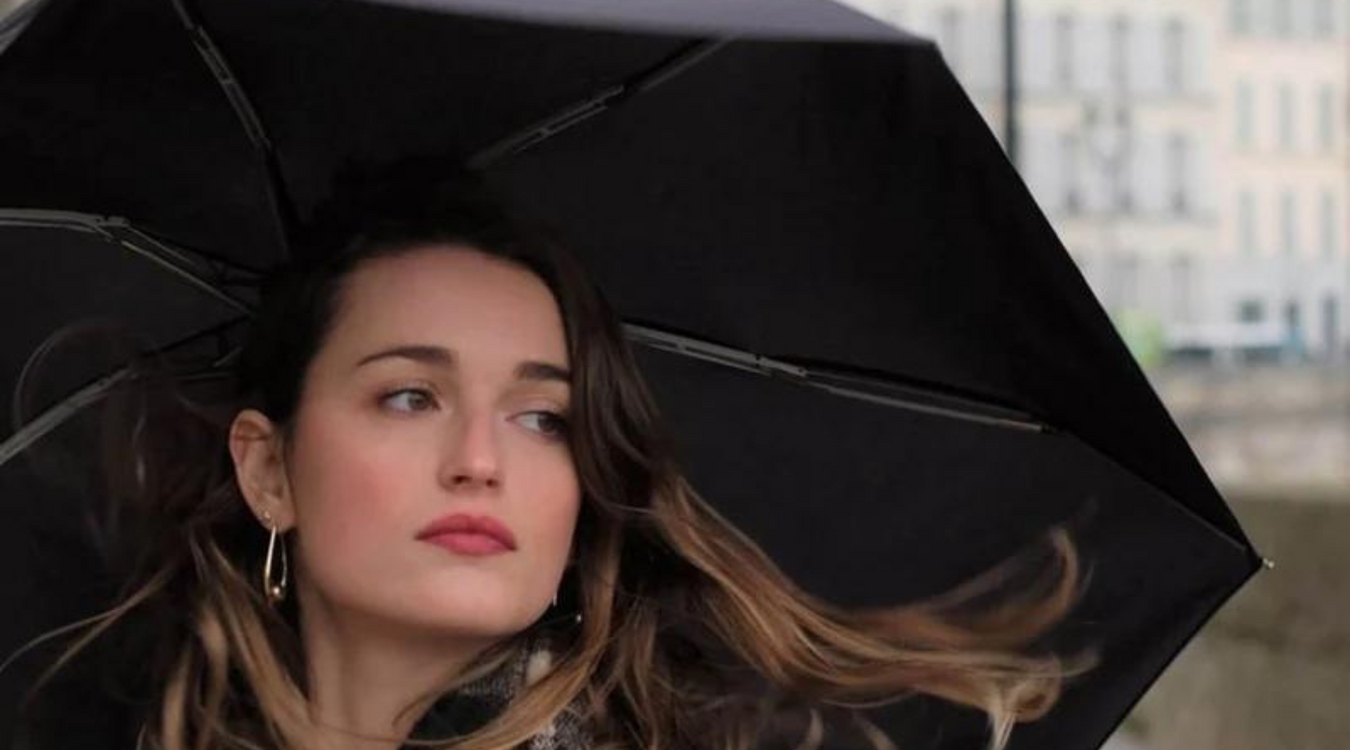 Parisian lady using a stylish black umbrella